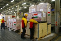 Japanese DHL employees store relief goods from EU